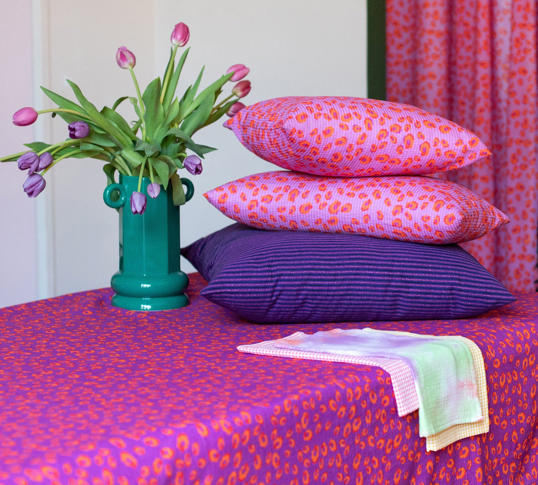 Iconic pink, purple and orange leopard pattern cushion - GEORGES
