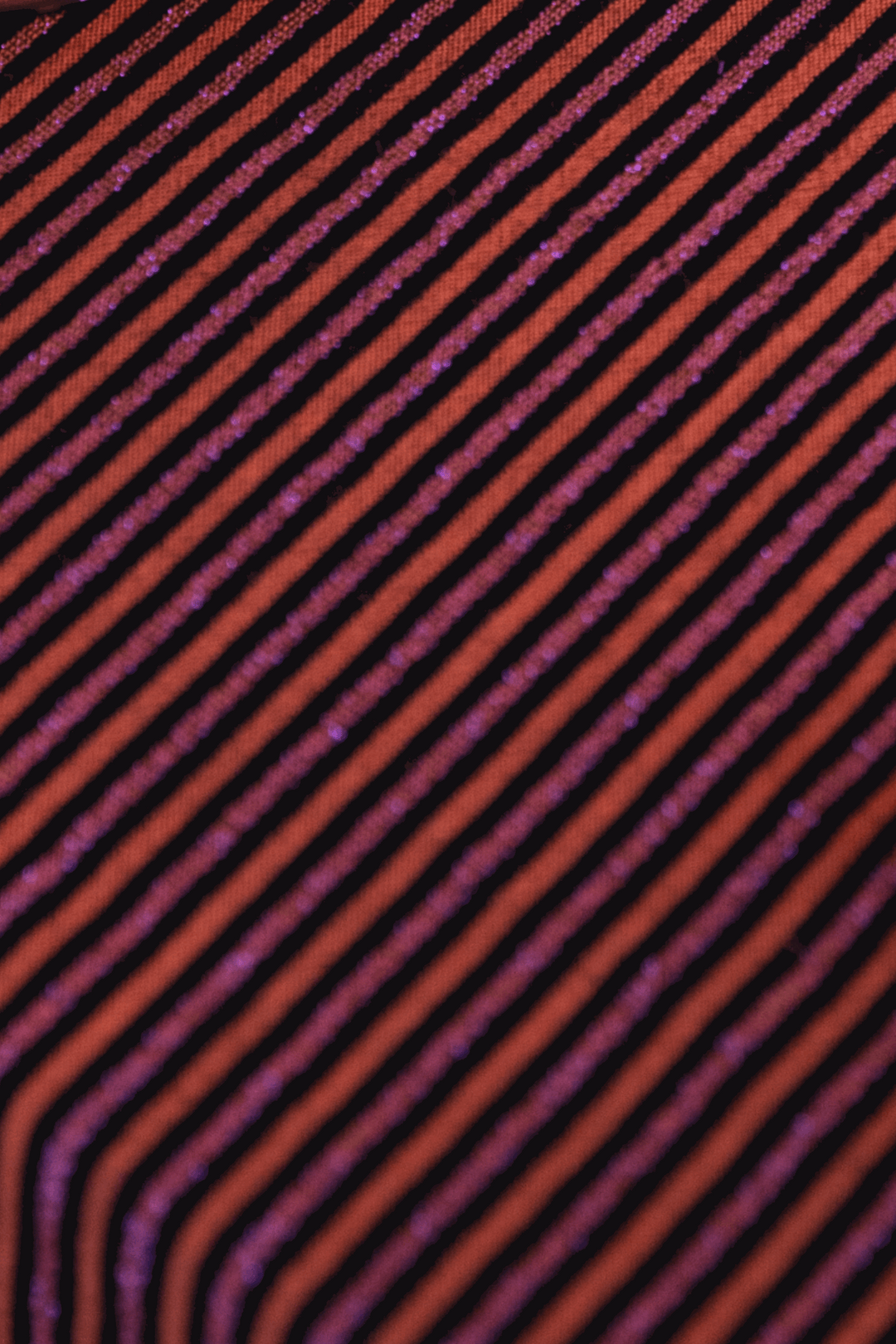 Coussin rouille et lignes irisées rose - ARMAND Coussin Maryne Guyot créations