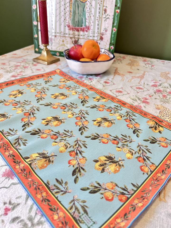 Set de table - Tissu anti-taches - Motifs oranges et citrons - Fond bleu